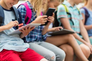 close up of elementary students with tablet pc
